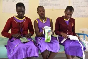 Girls in Purple Dresses Sitting Making Object