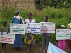 People Holding Signs Outside House